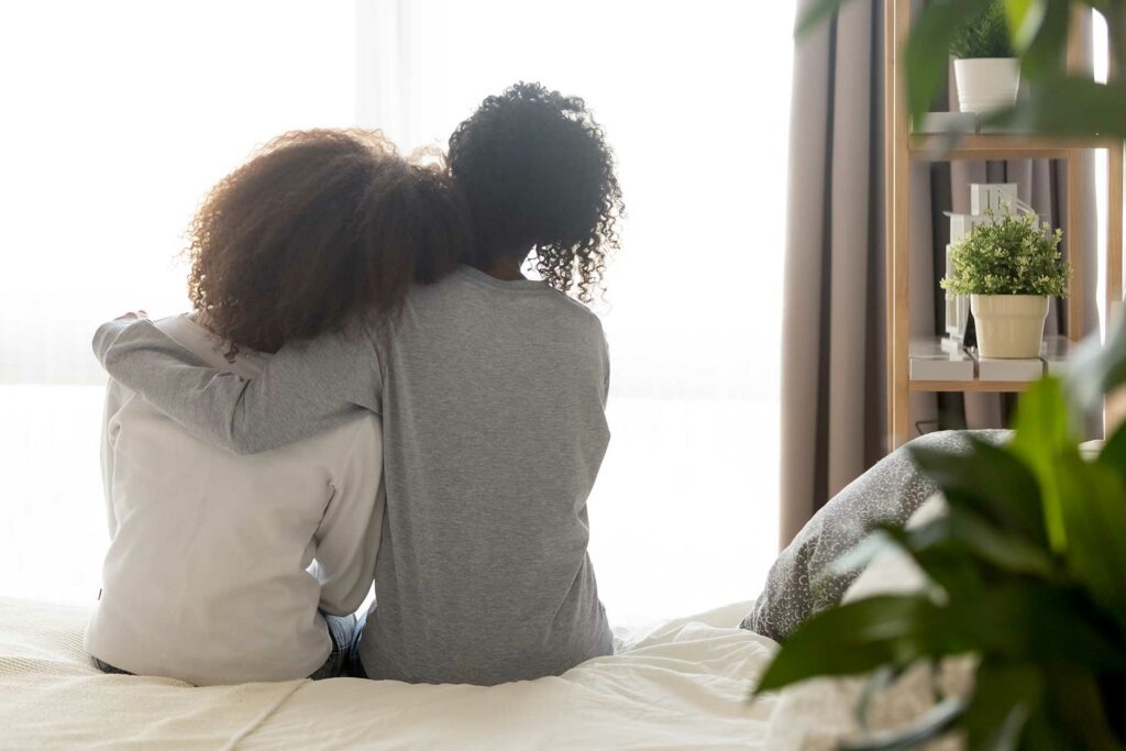 A mother and daughter share a moment of connection and empathy, highlighting the power of family support and professional care as a better solution for troubled teens.